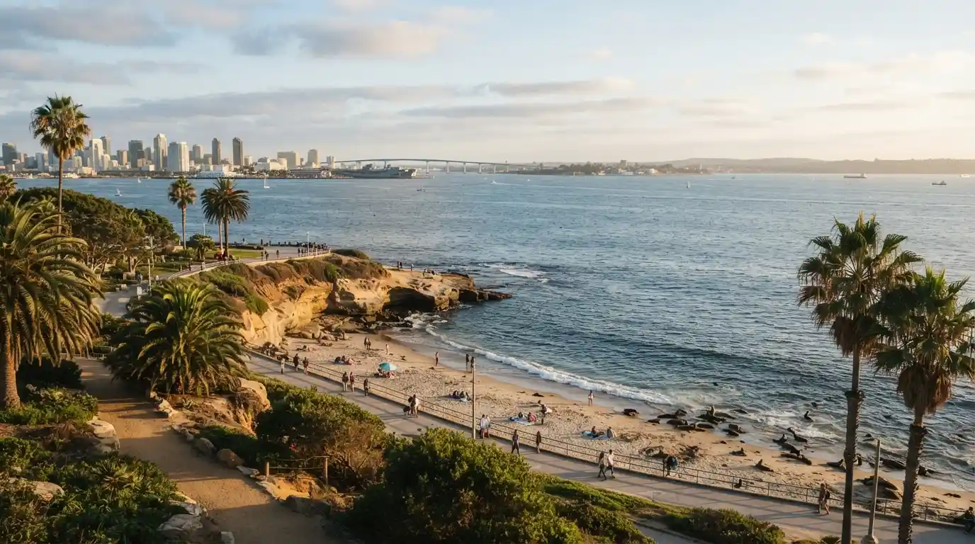 San Diego California coastline with palm trees, ocean views, and city scenery at golden hour