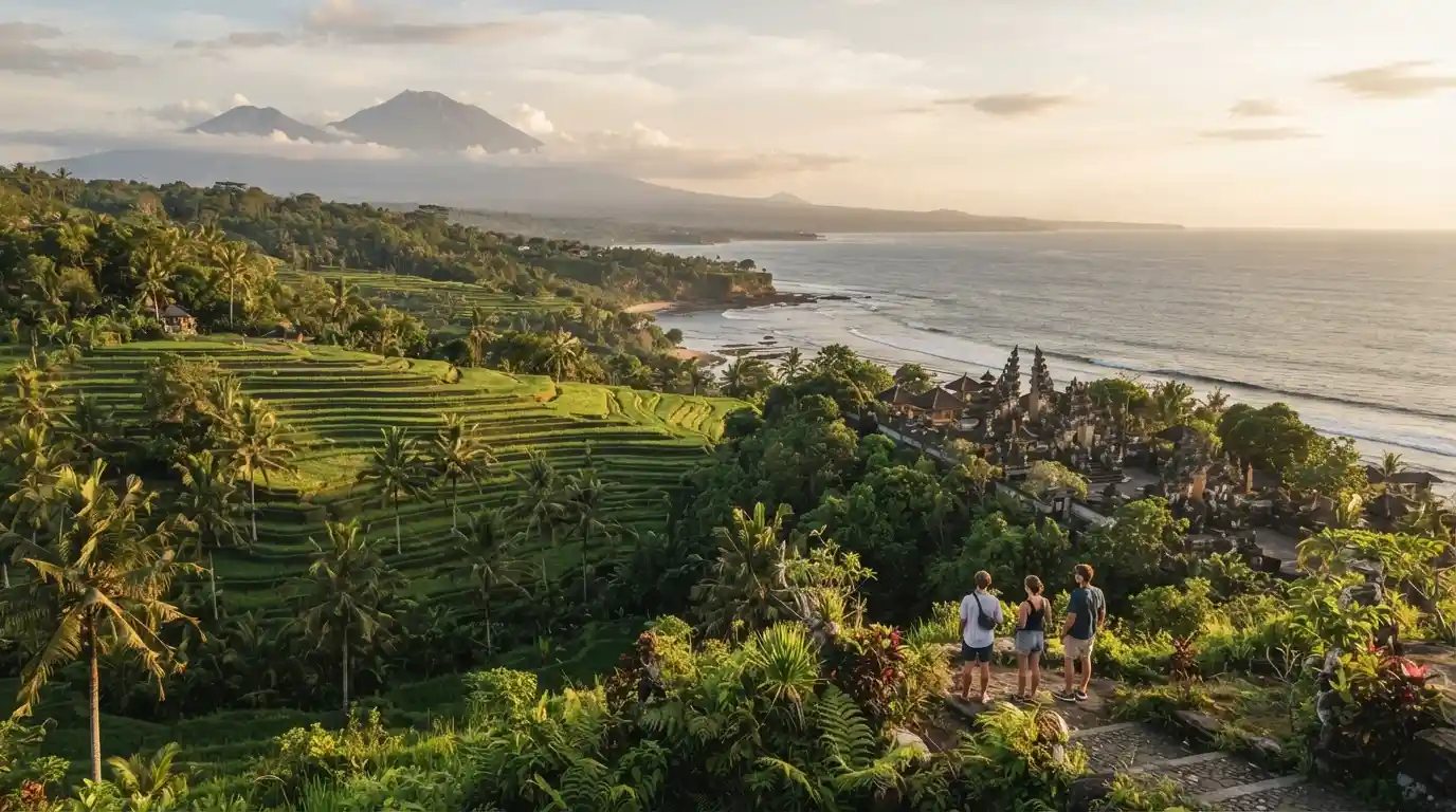 Tropical Bali landscape with a temple, green rice terraces, coastline, and volcanic mountains
