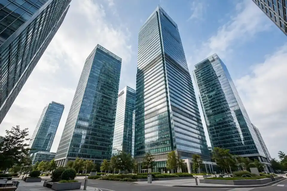 Modern glass corporate office towers representing a holding company structure